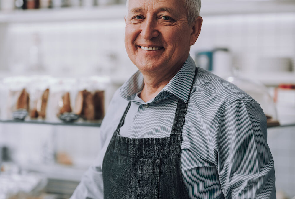 male business owner wearing apron